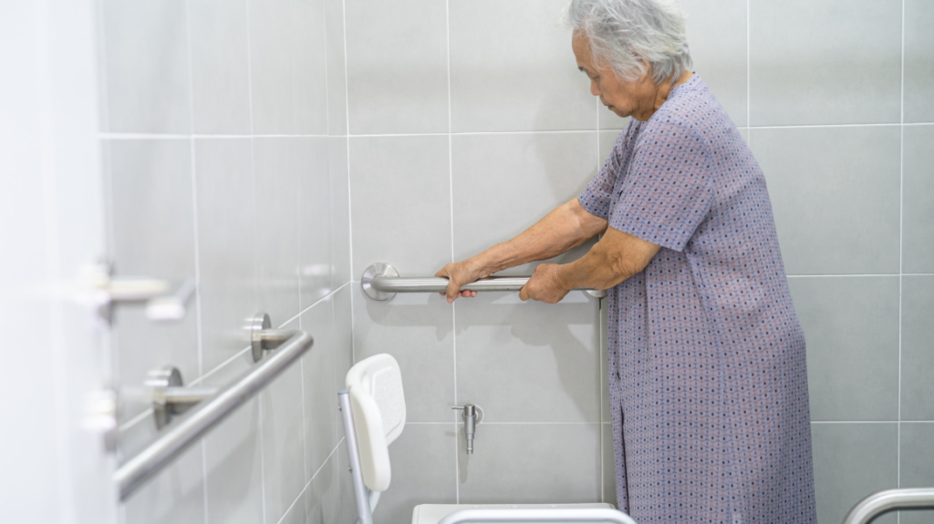 senior woman holding a grab bar